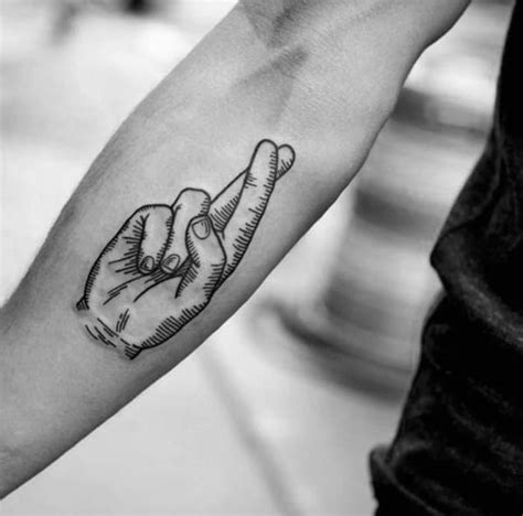 small fingers crossed tattoo|cross finger tattoo designs.